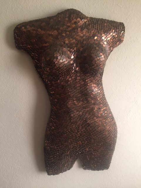 WOMAN'S TORSO MADE OF PENNIES